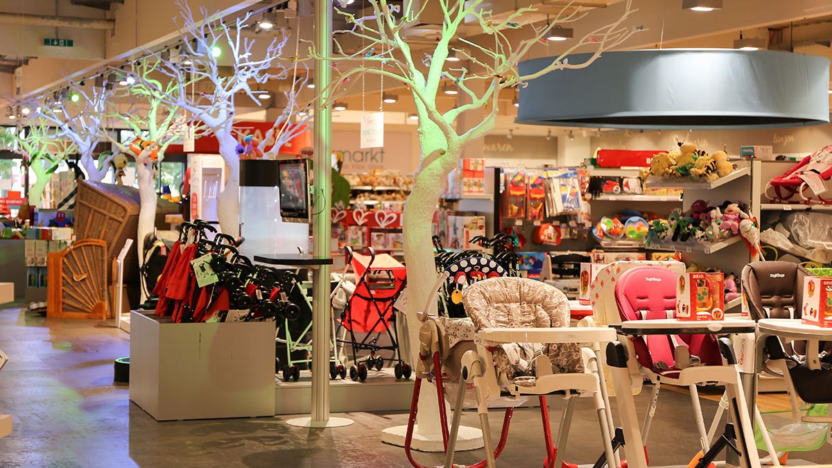 Photo showing a babymarkt store interior with various childcare-related items on display